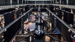 Exhibition space at Architect@Work London, featuring innovative architectural and design product displays within sleek, modular booths