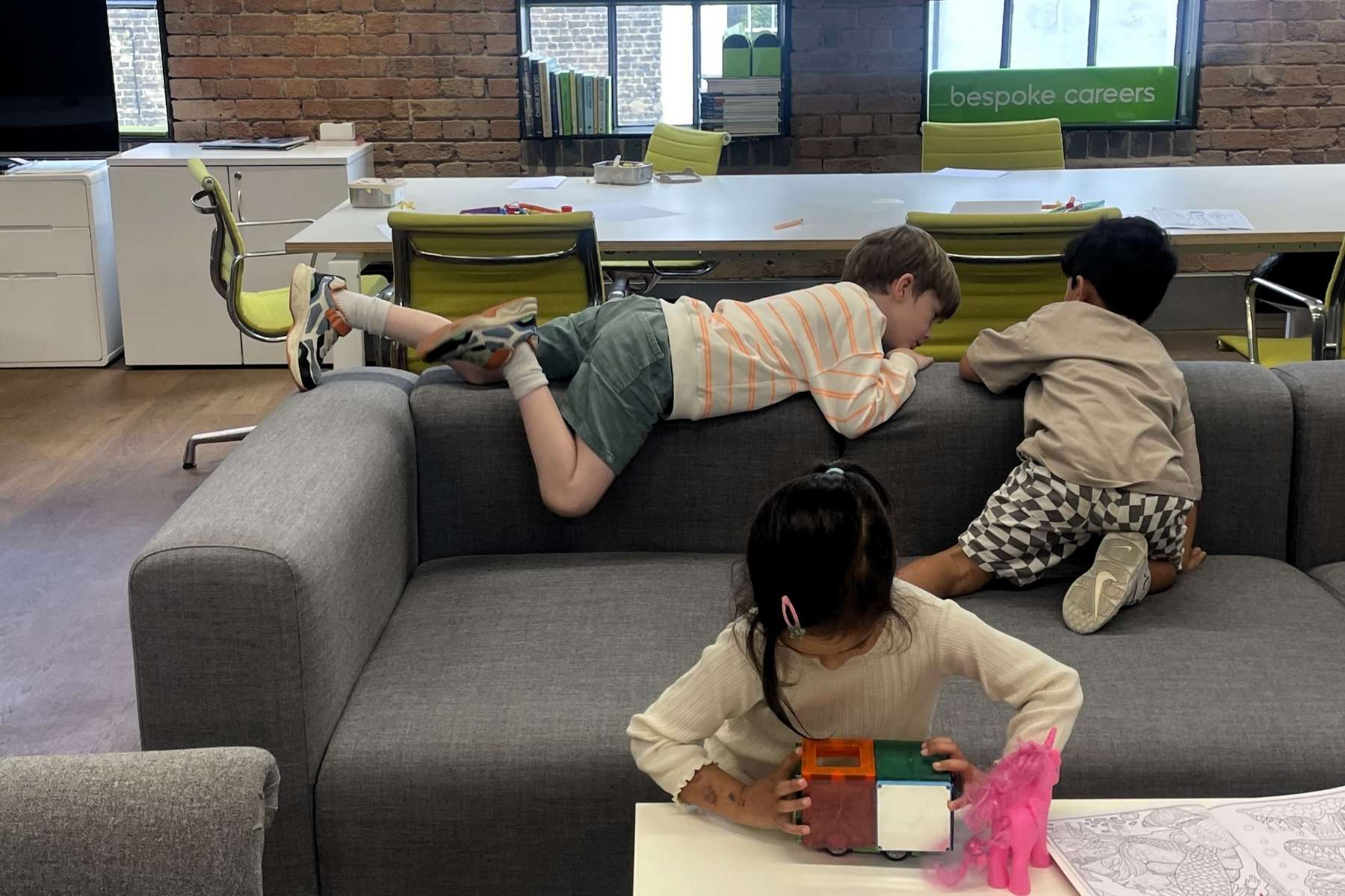 3 children playing in an office environment