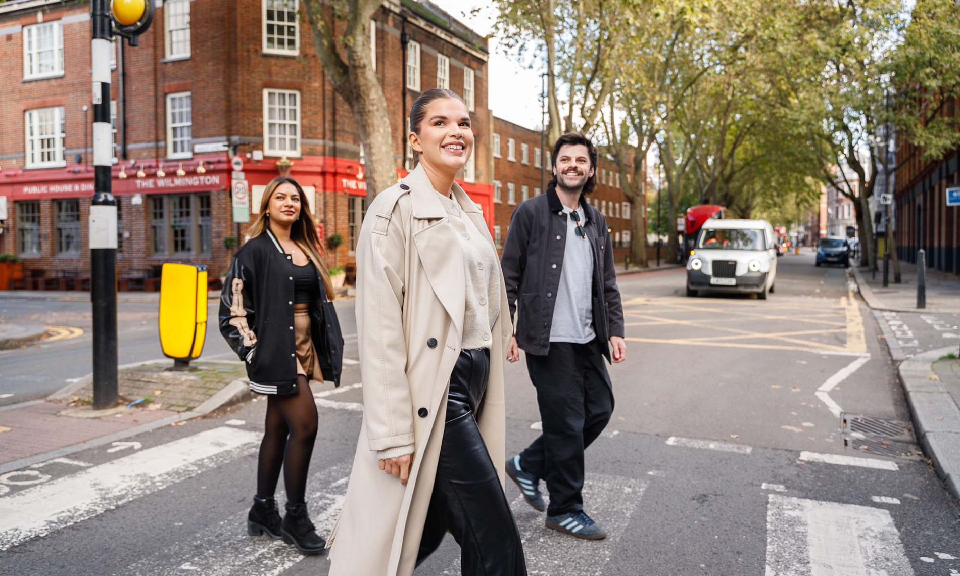 3 people crossing the road in Clerkenwell, London