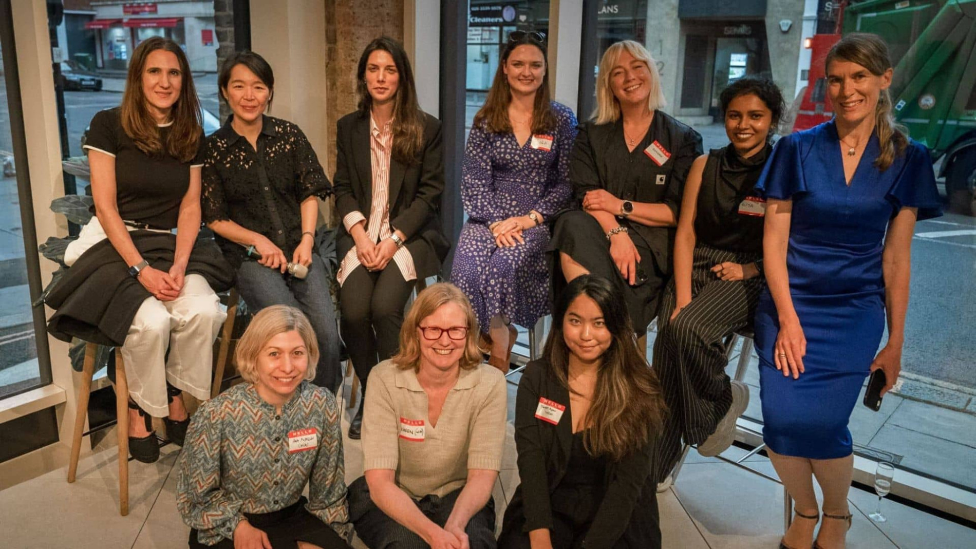 The Women in Architecture committee. 10 women are posing for the photograph.