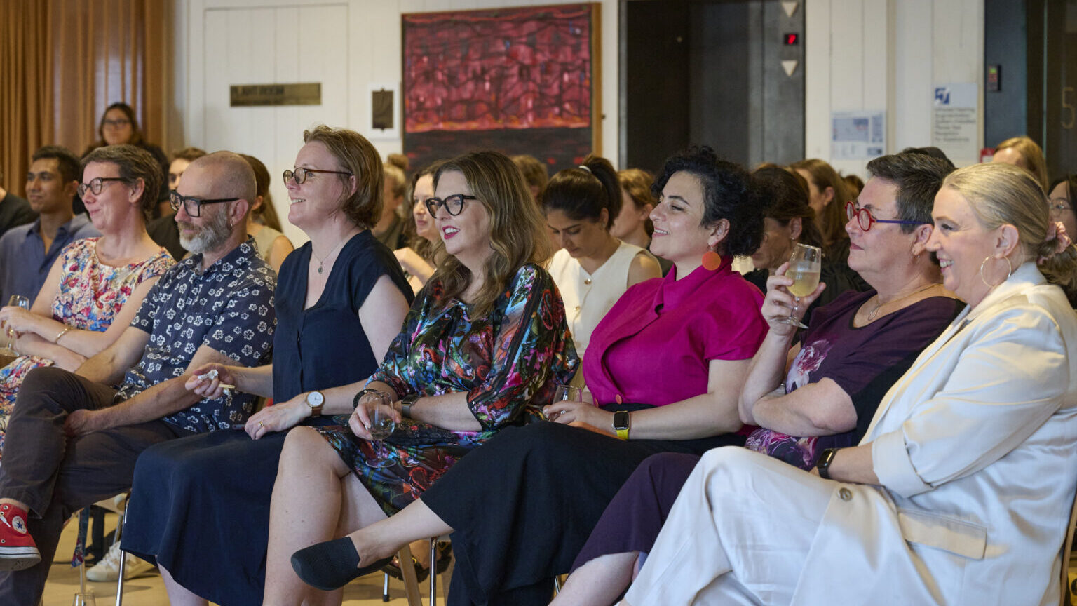 image of group of people watching someone present