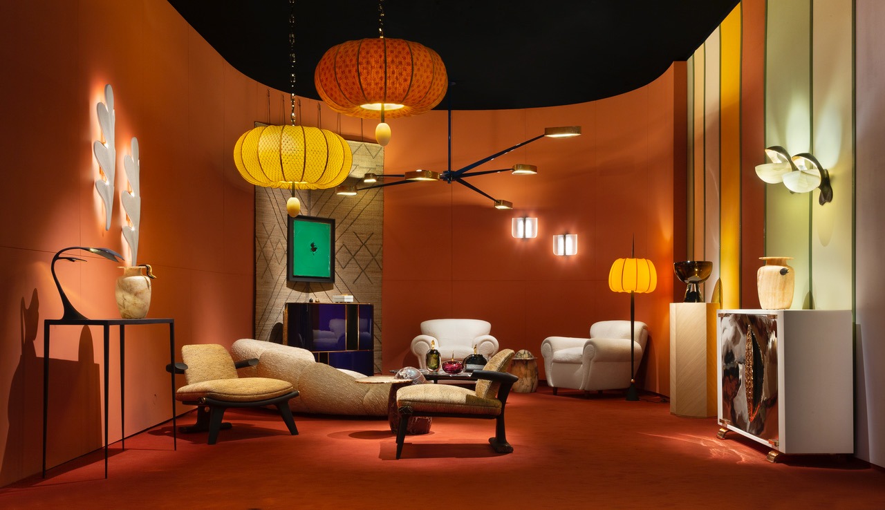 photo of a showroom with various design pieces such as arm chairs and vases.