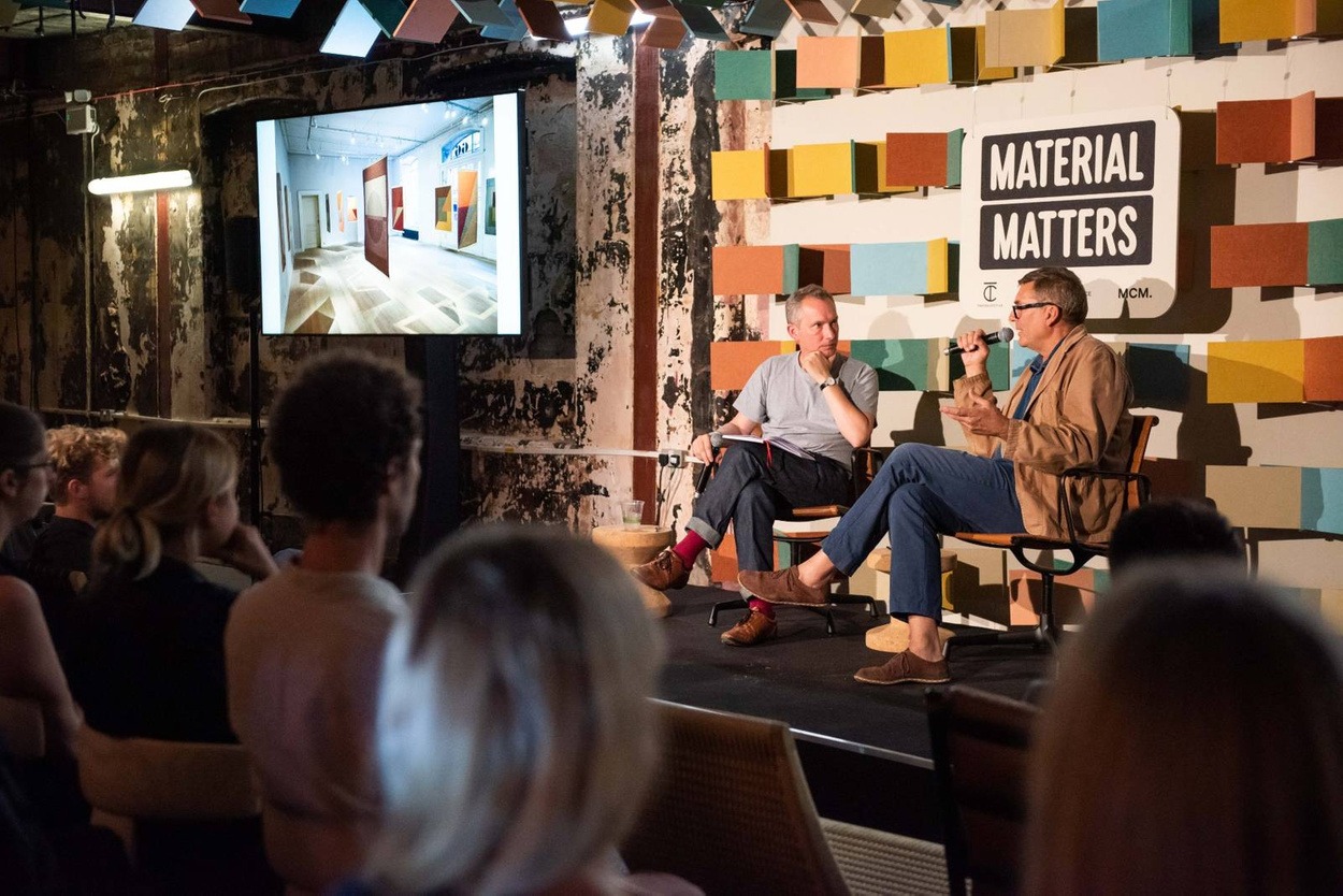 Photo of two panellists at the material matters conference having a conversation