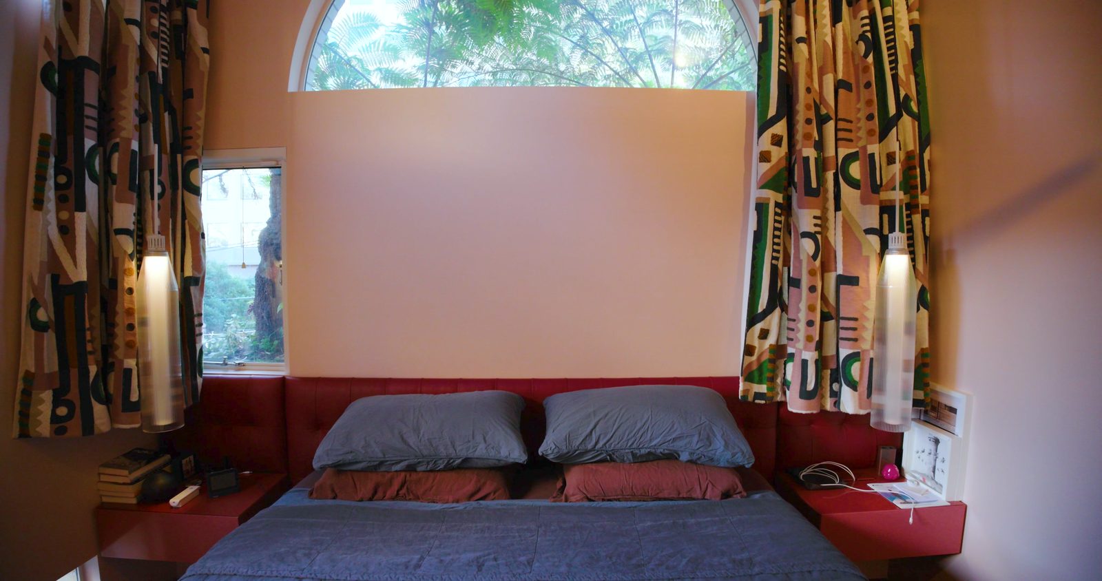 The bedroom with its half moon window