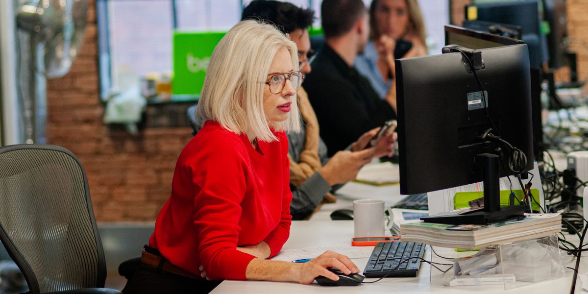 A Bespoke consultant reviewing a shortlist at her desk