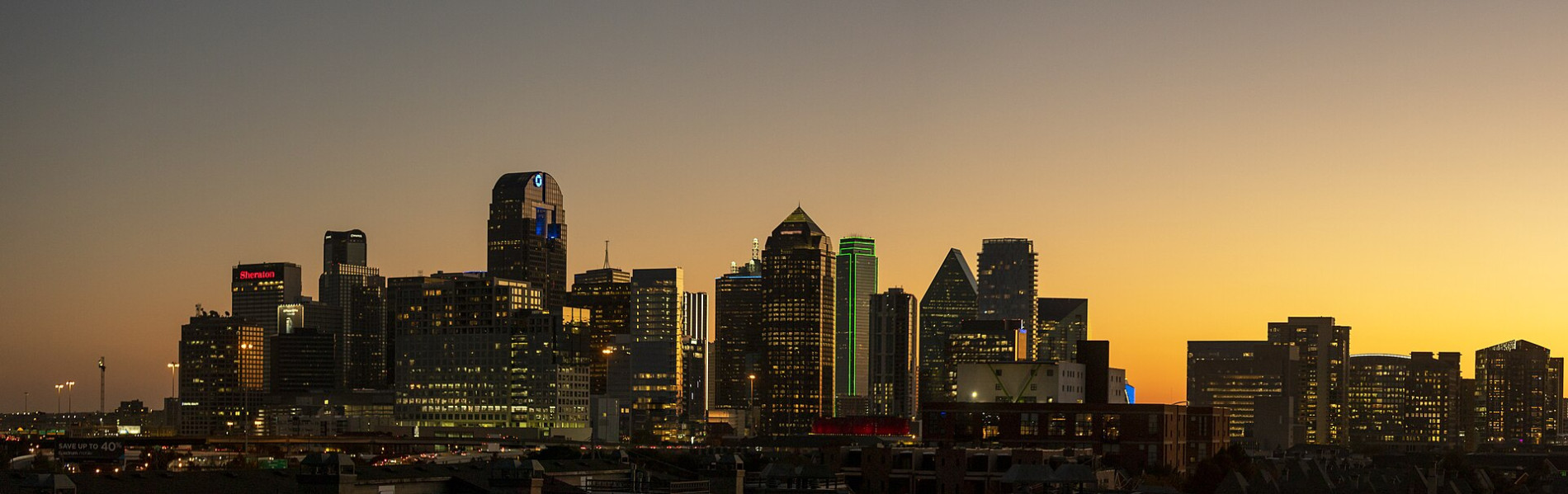 Dallas skyline at dusk, host city of the AIA Dallas Tour of Homes 2026
