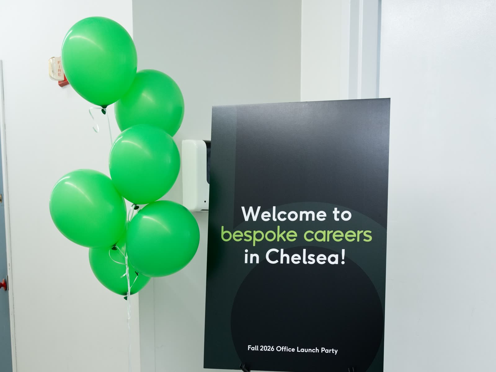 A Welcome to Bespoke Careers in Chelsea sign with green balloons