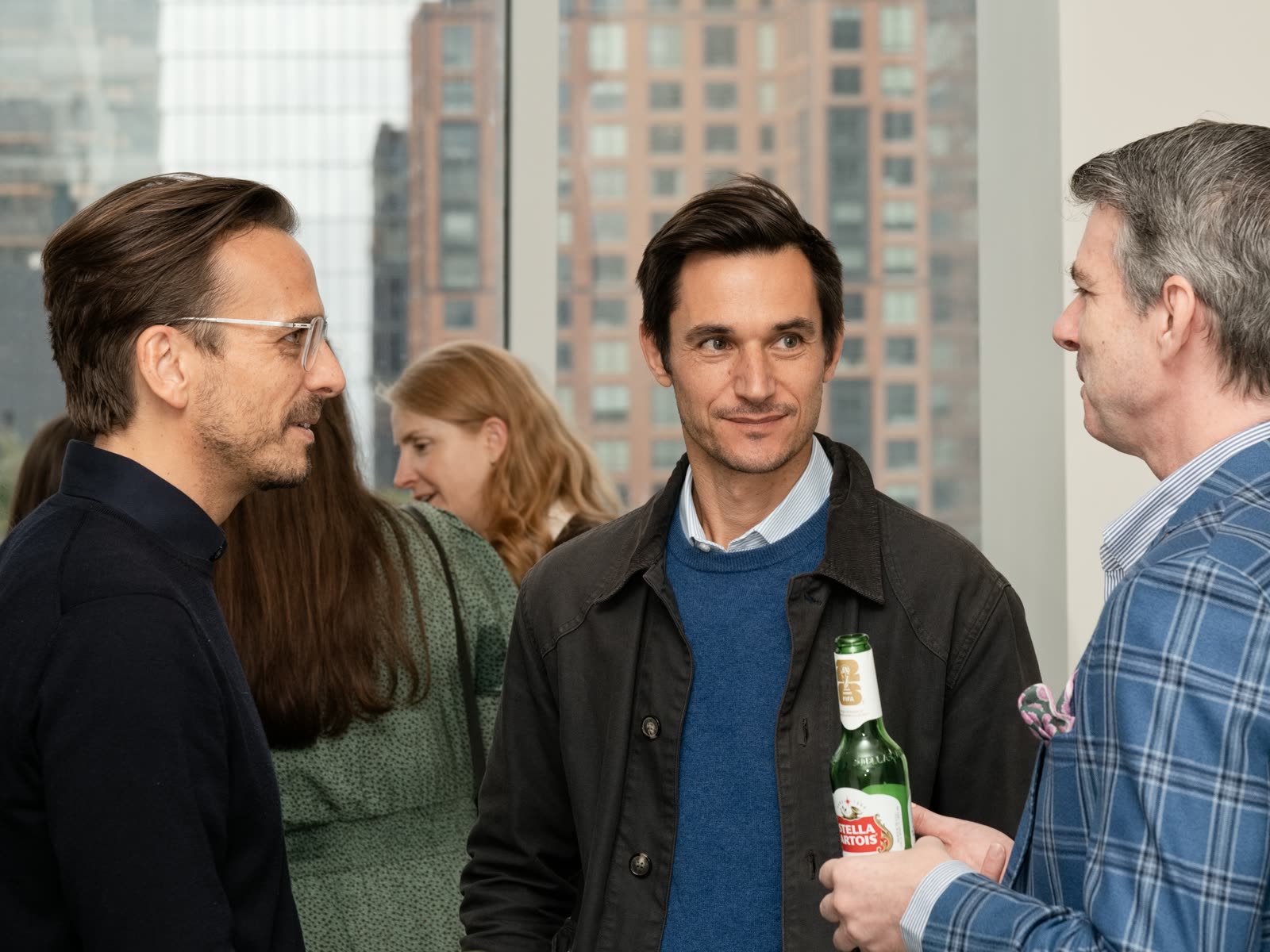 Three guests in conversation at the Bespoke New York office launch