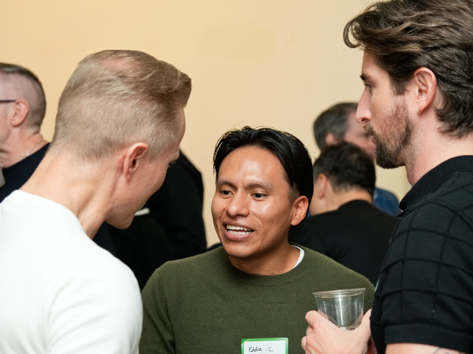 Guests laughing together at the Bespoke New York office launch