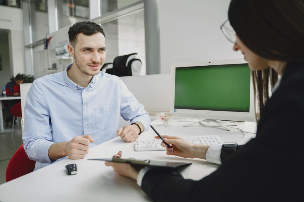 Candidate asking thoughtful interview questions to assess company culture during a job interview.