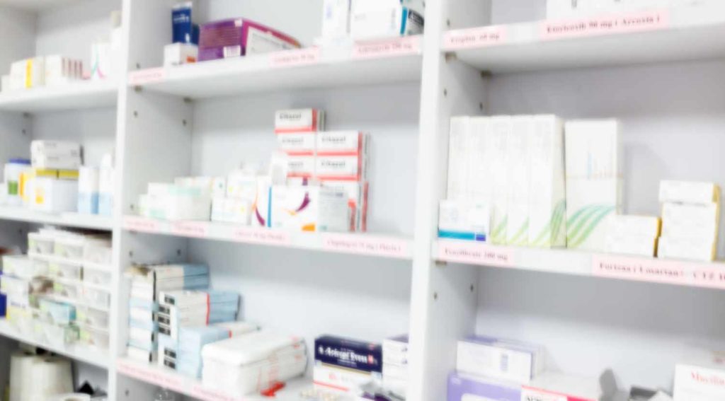 blur background drug shelves in drug store.
