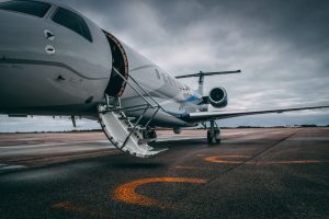 Plane with door open on tarmac